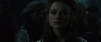 Movie still from “Pirates of the Caribbean: The Curse of the Black Pearl” (2003), directed by Gore Verbinski – A person wearing a white shirt; Close Up shot, Over the shoulder angle