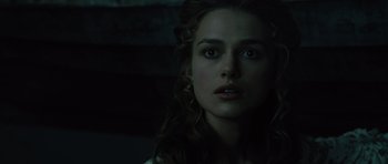 Movie still from “Pirates of the Caribbean: The Curse of the Black Pearl” (2003), directed by Gore Verbinski – A person with long curly hair; Close Up shot, Over the shoulder angle
