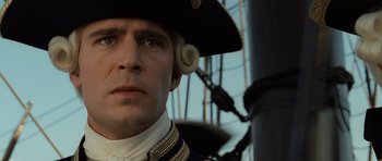 Movie still from “Pirates of the Caribbean: The Curse of the Black Pearl” (2003), directed by Gore Verbinski – A person wearing a hat; Close Up shot, Low angle