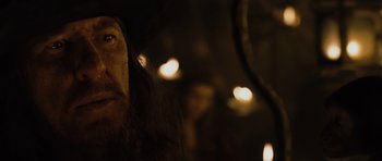 Movie still from “Pirates of the Caribbean: The Curse of the Black Pearl” (2003), directed by Gore Verbinski – A person with long hair; Close Up shot, Over the shoulder angle