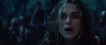 Movie still from “Pirates of the Caribbean: The Curse of the Black Pearl” (2003), directed by Gore Verbinski – A person with long blonde hair; Close Up shot, Over the shoulder angle