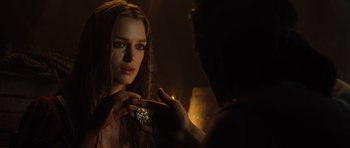 Movie still from “Pirates of the Caribbean: The Curse of the Black Pearl” (2003), directed by Gore Verbinski – A woman is holding a diamond in her hand; Close Up shot, Over the shoulder angle