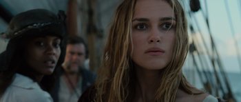 Movie still from “Pirates of the Caribbean: The Curse of the Black Pearl” (2003), directed by Gore Verbinski – A person with long blonde hair; Close Up shot, Over the shoulder angle