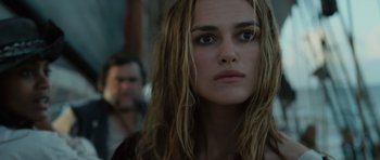 Movie still from “Pirates of the Caribbean: The Curse of the Black Pearl” (2003), directed by Gore Verbinski – A person with long brown hair; Close Up shot, Over the shoulder angle
