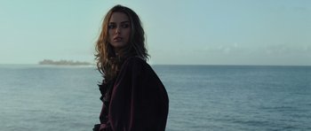 Movie still from “Pirates of the Caribbean: The Curse of the Black Pearl” (2003), directed by Gore Verbinski – A woman standing in front of a body of water; Close Up shot, Low angle