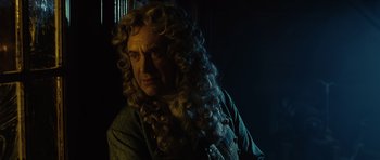 Movie still from “Pirates of the Caribbean: The Curse of the Black Pearl” (2003), directed by Gore Verbinski – A man with a long curly hair and a beard; Close Up shot, Over the shoulder angle
