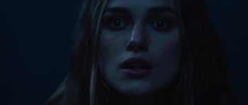 Movie still from “Pirates of the Caribbean: The Curse of the Black Pearl” (2003), directed by Gore Verbinski – A woman's face in the dark; Close Up shot, Over the shoulder angle