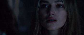 Movie still from “Pirates of the Caribbean: The Curse of the Black Pearl” (2003), directed by Gore Verbinski – A woman's face in the dark; Close Up shot, Over the shoulder angle