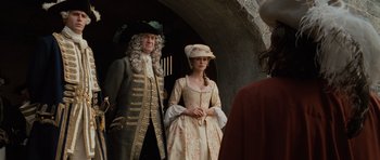Movie still from “Pirates of the Caribbean: The Curse of the Black Pearl” (2003), directed by Gore Verbinski – A man and a woman dressed in period clothing; Medium shot, Over the shoulder angle