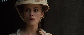 Movie still from “Pirates of the Caribbean: The Curse of the Black Pearl” (2003), directed by Gore Verbinski – A person wearing a hat; Close Up shot, Over the shoulder angle