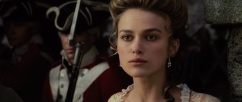 Movie still from “Pirates of the Caribbean: The Curse of the Black Pearl” (2003), directed by Gore Verbinski – A person wearing a dress; Close Up shot, Over the shoulder angle