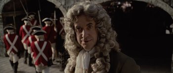 Movie still from “Pirates of the Caribbean: The Curse of the Black Pearl” (2003), directed by Gore Verbinski – A man in a wig and a wig and beard; Close Up shot, Over the shoulder angle