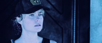 Movie still from “Pitch Black” (2000), directed by David Twohy – A person wearing a hat; Close Up shot, Low angle