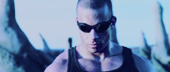 Movie still from “Pitch Black” (2000), directed by David Twohy – A person wearing goggles; Close Up shot, Low angle