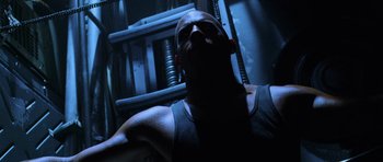 Movie still from “Pitch Black” (2000), directed by David Twohy – A person in a dark room; Close Up shot, Low angle