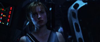 Movie still from “Pitch Black” (2000), directed by David Twohy – A person wearing a tank top; Close Up shot, Low angle