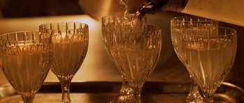 Movie still from “Pitch Black” (2000), directed by David Twohy – A person pouring wine into a wine glass; Extreme Close Up shot, High angle