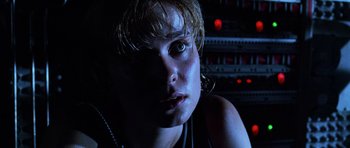 Movie still from “Pitch Black” (2000), directed by David Twohy – A young man with blonde hair is staring at the camera; Close Up shot, Low angle
