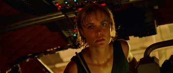 Movie still from “Pitch Black” (2000), directed by David Twohy – A person wearing a tank top; Close Up shot, Low angle