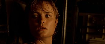 Movie still from “Pitch Black” (2000), directed by David Twohy – A person's face in the dark; Close Up shot, Low angle