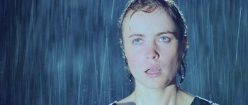 Movie still from “Pitch Black” (2000), directed by David Twohy – A person with wet hair; Close Up shot, Low angle