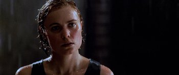 Movie still from “Pitch Black” (2000), directed by David Twohy – A person with wet hair; Close Up shot, Low angle