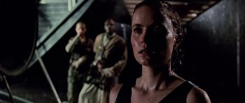 Movie still from “Pitch Black” (2000), directed by David Twohy – A person wearing a tank top; Close Up shot, Over the shoulder angle
