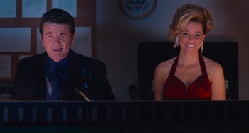 Movie still from “Pitch Perfect” (2012), directed by Jason Moore – A man and a woman sitting in front of a piano; Medium shot, Over the shoulder angle