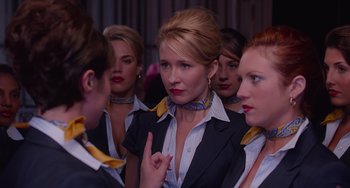 Movie still from “Pitch Perfect” (2012), directed by Jason Moore – A group of women standing next to each other in a room; Close Up shot, Over the shoulder angle