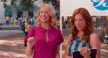 Movie still from “Pitch Perfect” (2012), directed by Jason Moore – Two beautiful women standing next to each other; Medium shot, Over the shoulder angle