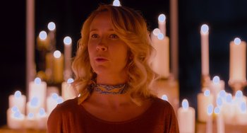 Movie still from “Pitch Perfect” (2012), directed by Jason Moore – A woman with blonde curly hair wearing a red shirt; Close Up shot, Low angle