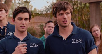 Movie still from “Pitch Perfect” (2012), directed by Jason Moore – A group of young men standing next to each other; Medium shot, Over the shoulder angle