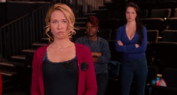 Movie still from “Pitch Perfect” (2012), directed by Jason Moore – Three women standing in front of each other; Medium shot, Over the shoulder angle