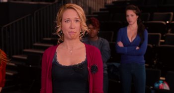 Movie still from “Pitch Perfect” (2012), directed by Jason Moore – Three women are standing in front of each other; Close Up shot, Over the shoulder angle