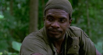 Movie still from “Platoon” (1986), directed by Oliver Stone – A person wearing a hat; Close Up shot, Low angle