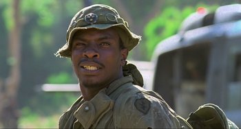 Movie still from “Platoon” (1986), directed by Oliver Stone – A man wearing a hat and a uniform; Close Up shot, Low angle