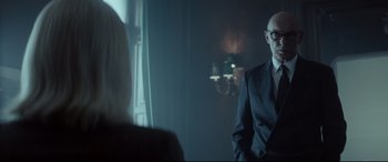 Movie still from “Atomic Blonde” (2017), directed by David Leitch – A man and a woman in a dark room; Medium shot, Over the shoulder angle
