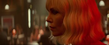Movie still from “Atomic Blonde” (2017), directed by David Leitch – A person with blonde hair; Close Up shot, Over the shoulder angle