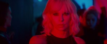 Movie still from “Atomic Blonde” (2017), directed by David Leitch – Charlize theron in a red light; Close Up shot, Over the shoulder angle