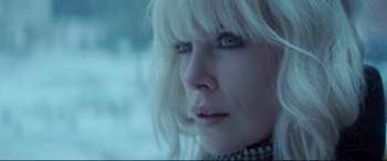 Movie still from “Atomic Blonde” (2017), directed by David Leitch – A person with long white hair; Close Up shot, Low angle