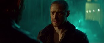 Movie still from “Atomic Blonde” (2017), directed by David Leitch – A person in a dark room; Close Up shot, Over the shoulder angle