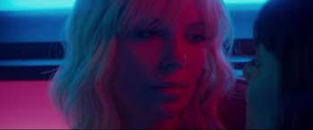 Movie still from “Atomic Blonde” (2017), directed by David Leitch – A person with long blonde hair; Close Up shot, Low angle