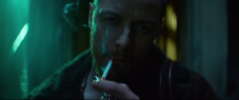 Movie still from “Atomic Blonde” (2017), directed by David Leitch – A person smoking a cigarette; Close Up shot, Low angle