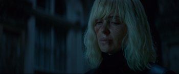 Movie still from “Atomic Blonde” (2017), directed by David Leitch – A person wearing a black shirt; Close Up shot, Over the shoulder angle