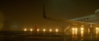 Movie still from “Atomic Blonde” (2017), directed by David Leitch – An airplane on a runway at night with lights on; Extreme Wide shot, Low angle