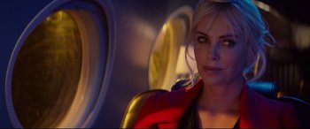 Movie still from “Atomic Blonde” (2017), directed by David Leitch – A beautiful blonde woman with a red and yellow jacket; Close Up shot, Over the shoulder angle