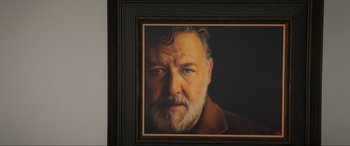 Movie still from “Poker Face” (2022), directed by Russell Crowe – A painting of an older man with a beard; Extreme Close Up shot, Low angle
