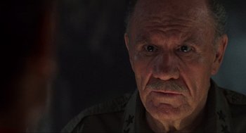 Movie still from “Predator” (1987), directed by John McTiernan – An old man with a beard and a mustache; Close Up shot, Low angle