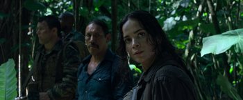 Movie still from “Predators” (2010), directed by Nimród Antal – A man and a woman standing next to each other in the woods; Close Up shot, Over the shoulder angle