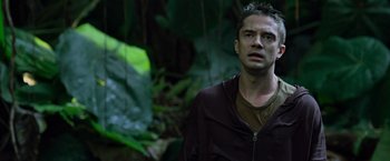 Movie still from “Predators” (2010), directed by Nimród Antal – A man standing in the middle of a forest; Close Up shot, Low angle